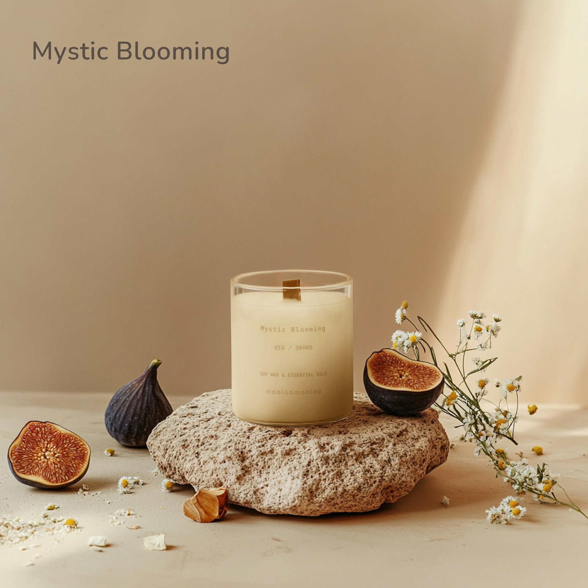 Mystic Blooming scented candle by Mooloomooloo displayed on a natural stone, surrounded by fresh figs, chamomile flowers, and soft warm light.